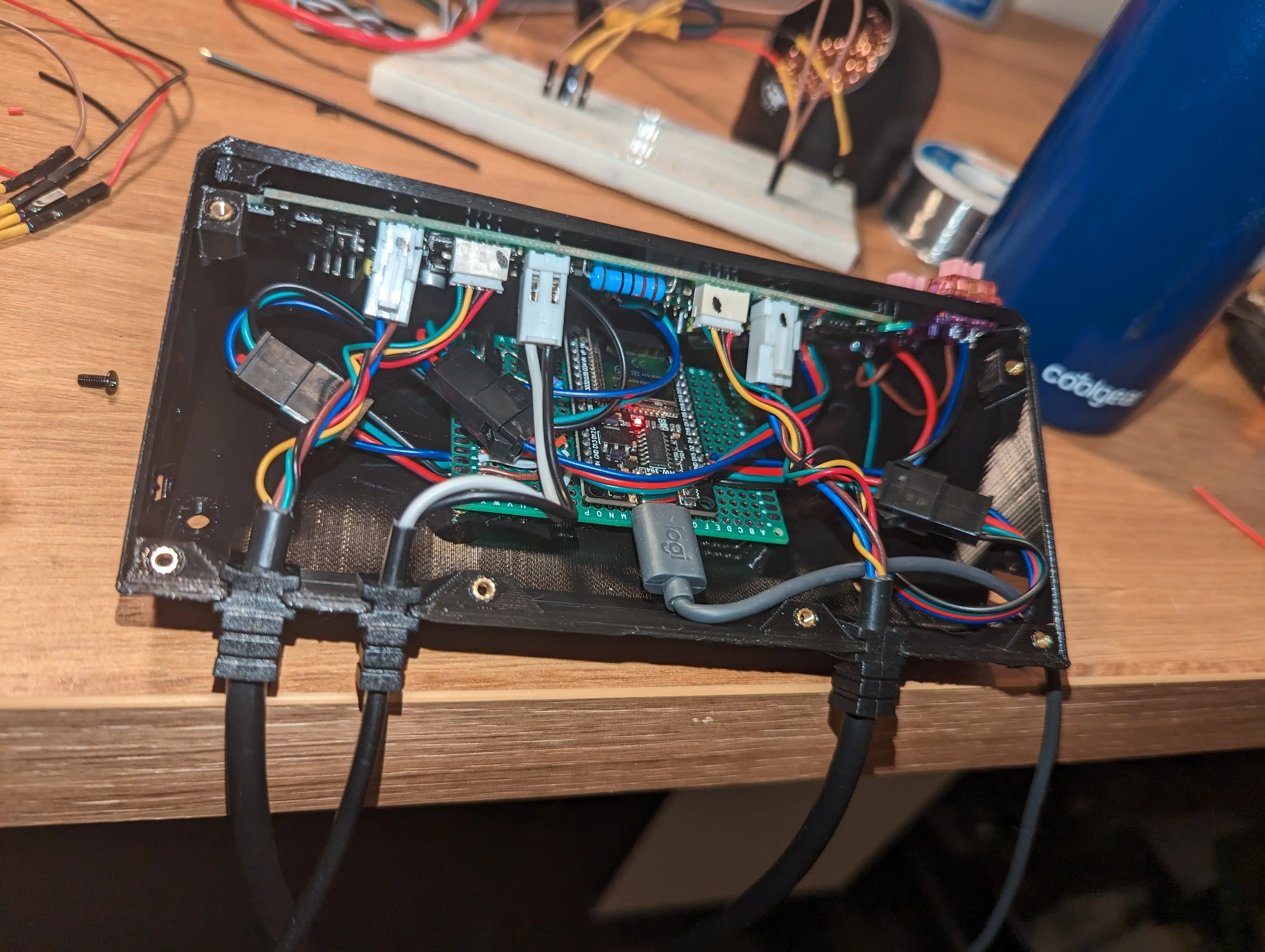 The resultant enclosure, showing the protoboard from above as well as the original circuit board installed