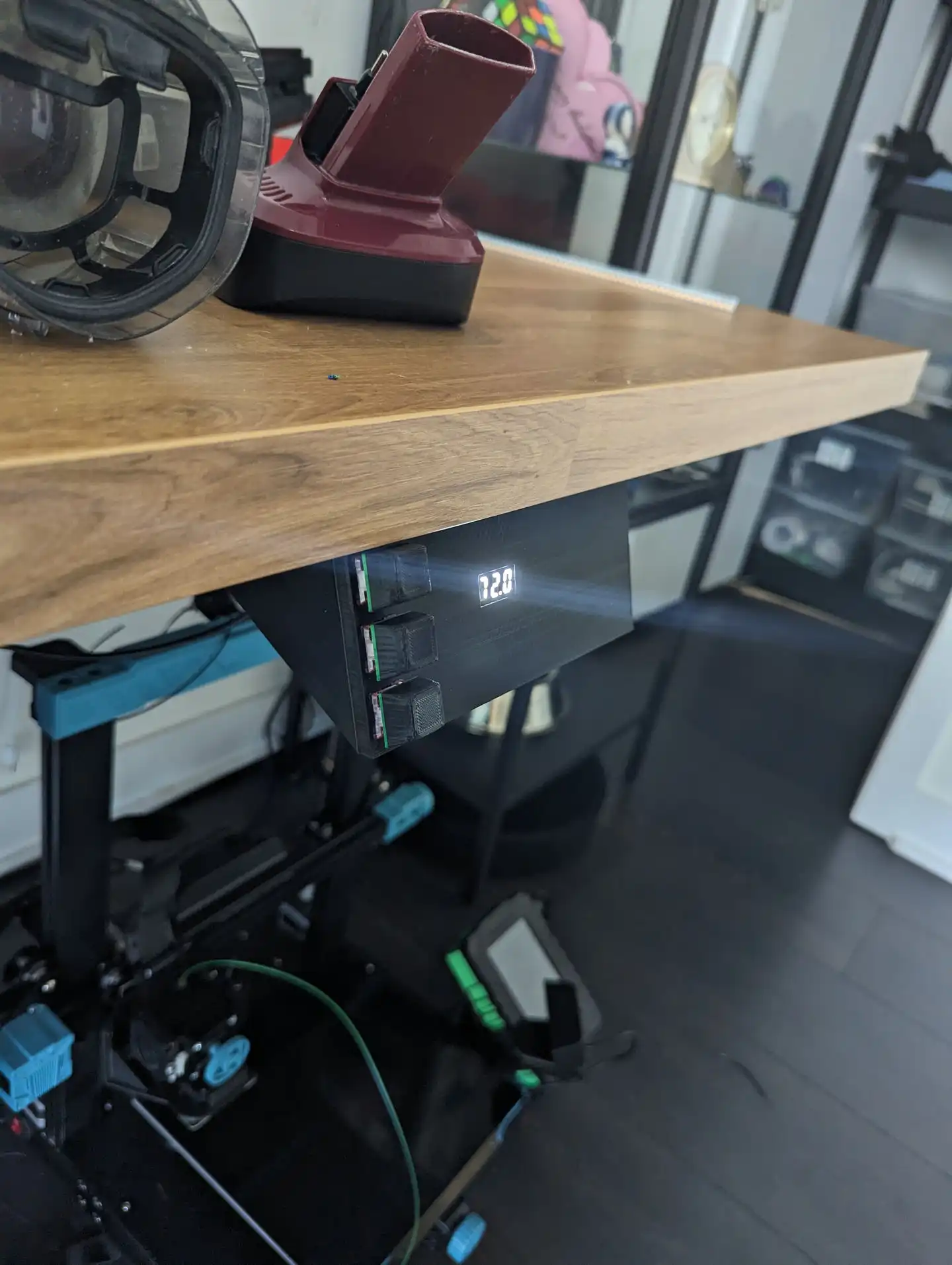A photo of a very obviously 3d printed standing desk controller with 3 mechanical keyboard switches on the front